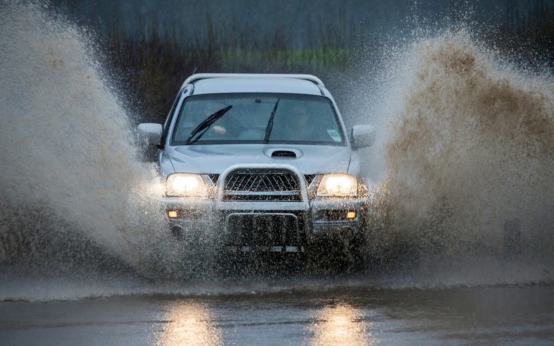 Car Driving Through Rain