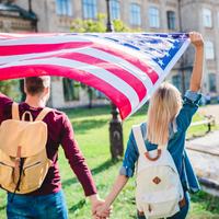 Students holding American Flag