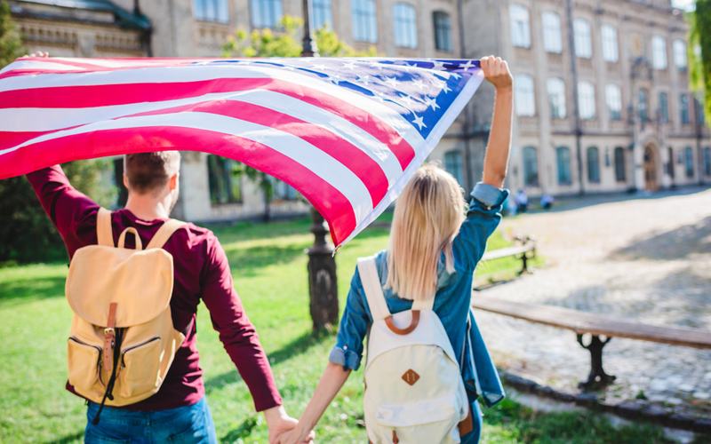 Students holding American Flag