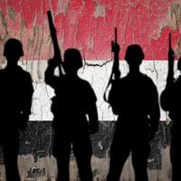 Yemen Flag and Soldiers - Shutterstock
