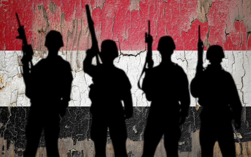 Yemen Flag and Soldiers - Shutterstock