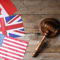 US, Canada, UK Flags and Gavel - Shutterstock