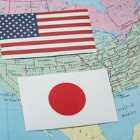US and Japan Flags - Shutterstock
