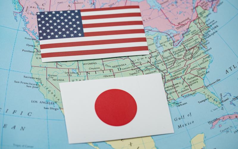 US and Japan Flags - Shutterstock